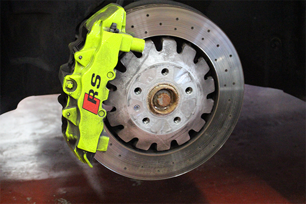 Green brake caliper on rotor
