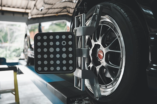 car on wheel alignment rack